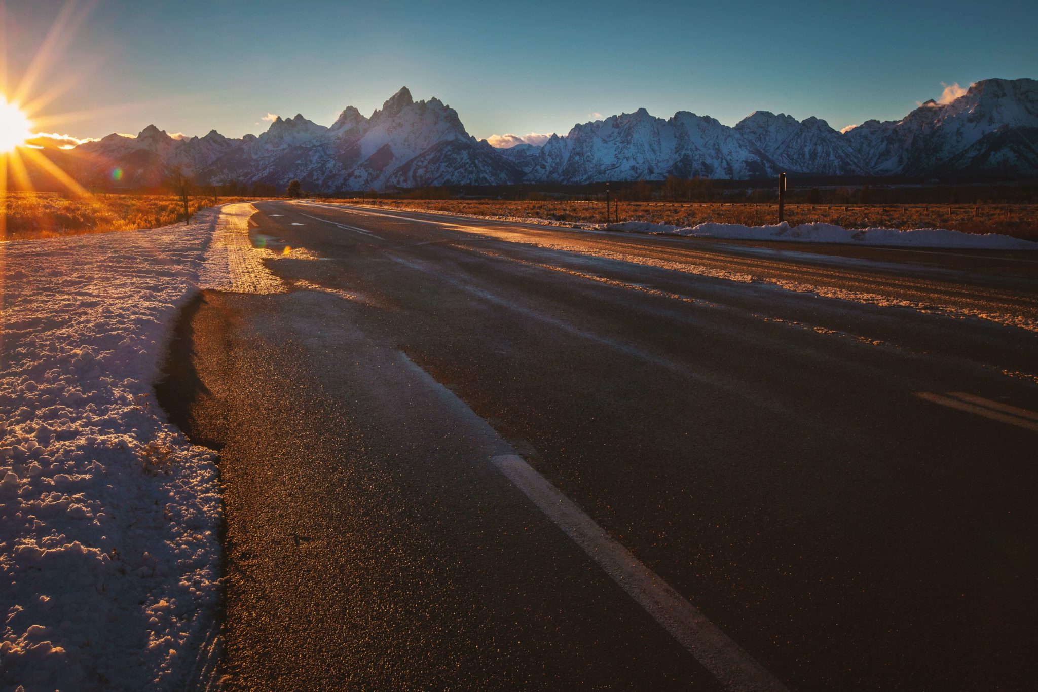 A road leads into Jackson Hole, Wyoming, as you travel in after flying or driving in.